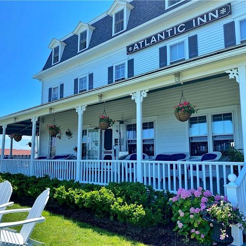 A large white building with a porch, labeled 